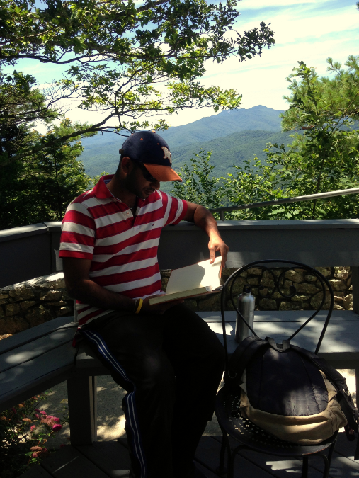 Prithvi enjoying a book in the mountains, Blowing Rock, NC.